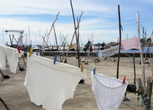 Clothes hanging outside in public in Afurada