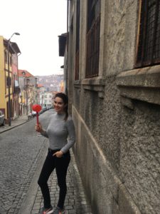How To Celebrate São João like a true Tripeiro - girl holding a plastic hammer