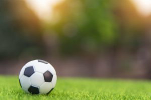 A football laying on grass